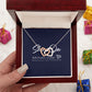 Interlocking Hearts Necklace - Silver and Gold